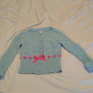 Greendog girls 6X lite blue with pink ribbon sweater.